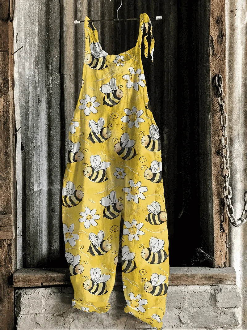 Solea | Lightweight artisanal jumpsuit in yellow cartoon bee & daisy print