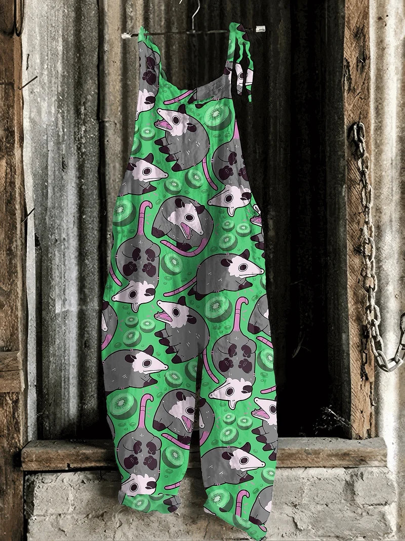 Solea | Lightweight artisanal jumpsuit in green cartoon possum & kiwi print